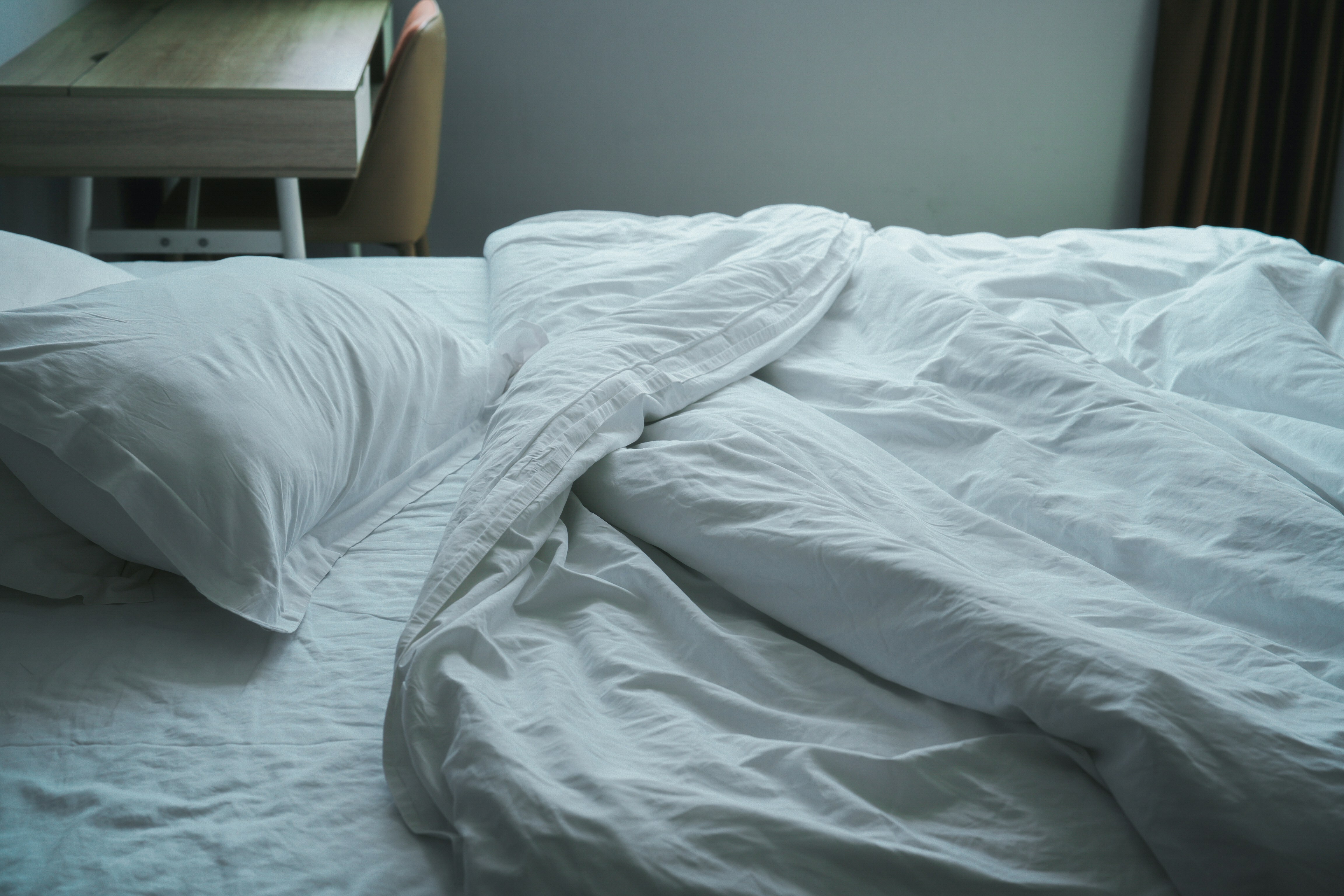 bed with white sheets