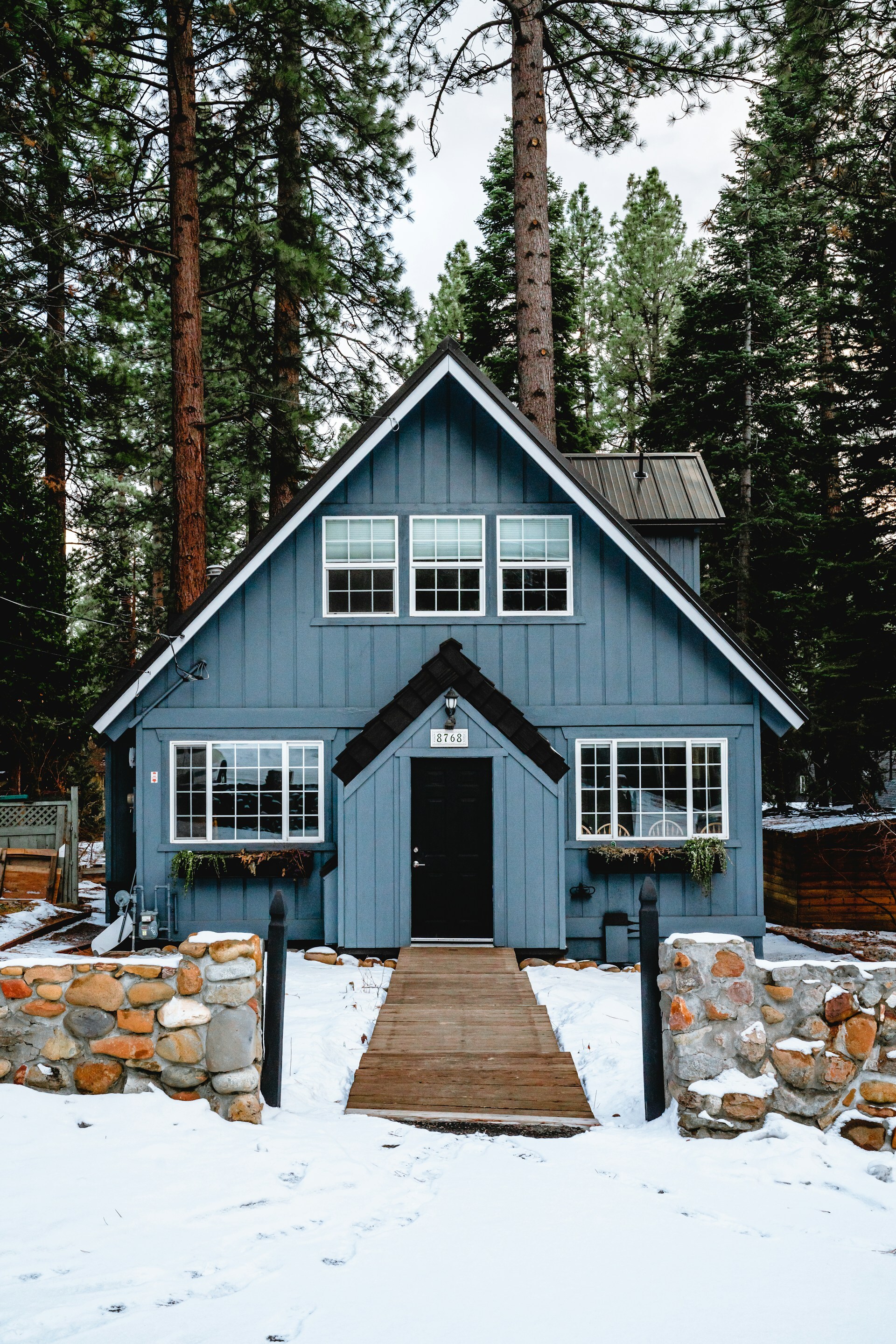 blue house with snow